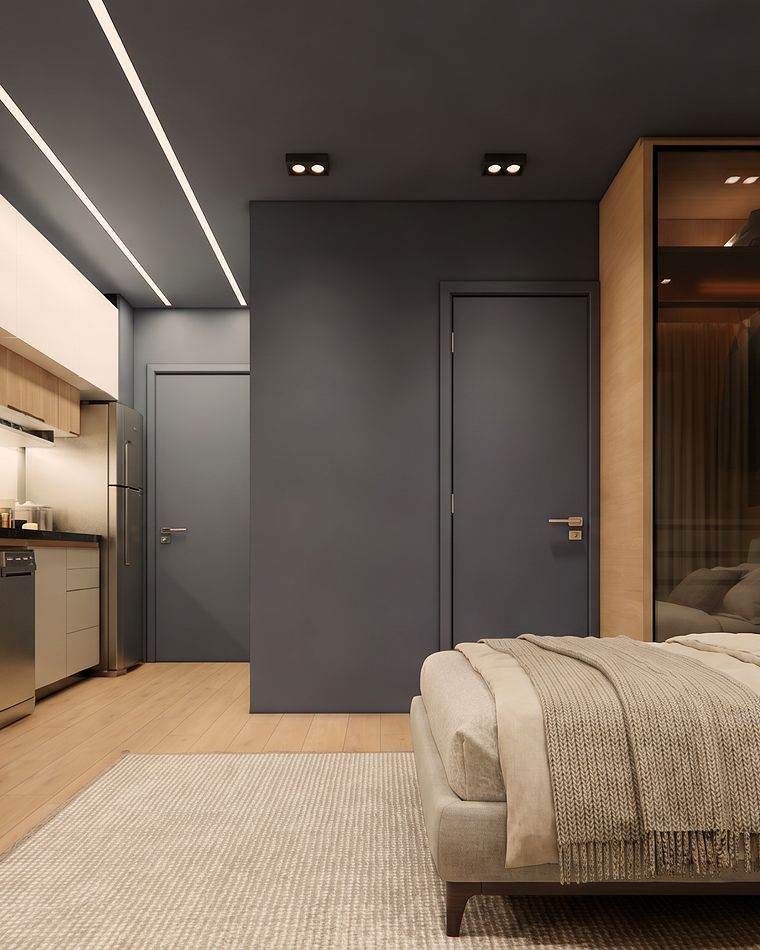 Studio com parede azul, TV, bancada de trabalho e cama
