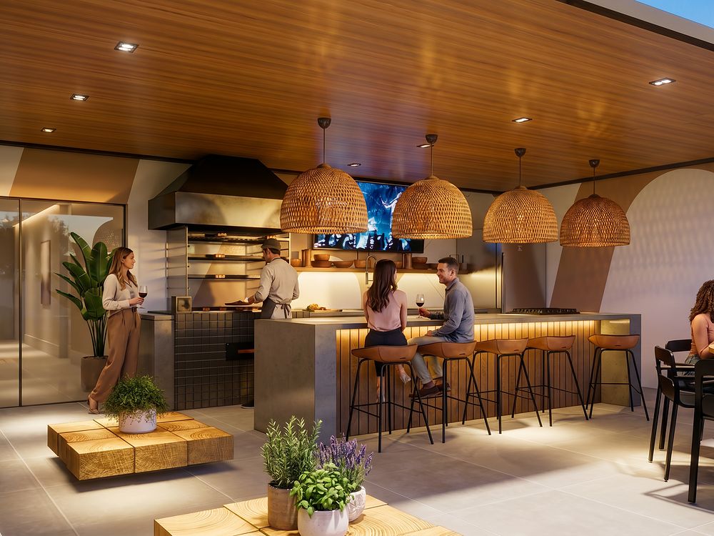 Espaço gourmet com bancada, banquetas e churrasqueira