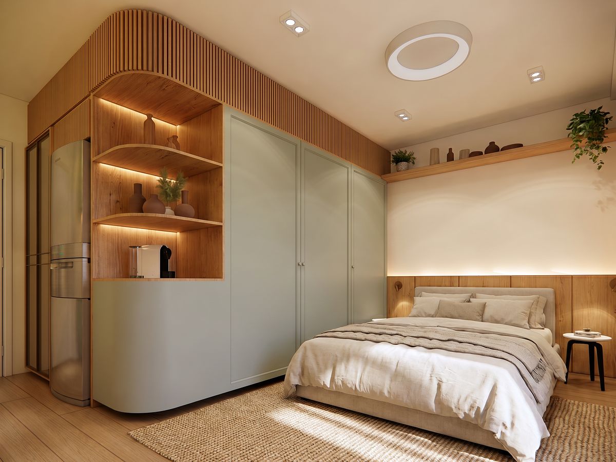 Studio decorado em verde-claro e madeira, com cama de casal e armários